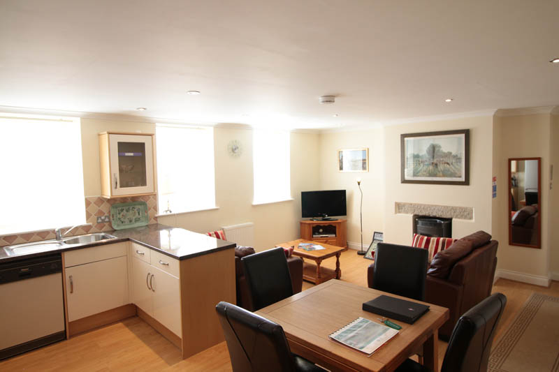 Pewtor apartment lounge and kitchen area Langstone Manor